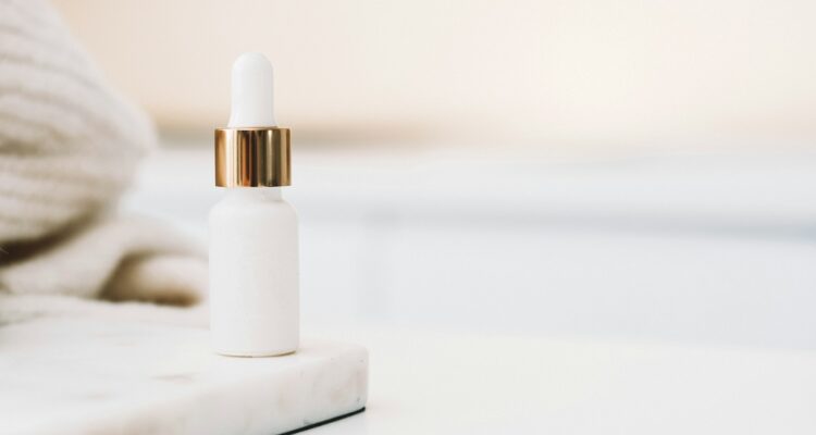 white drop bottle on white surface